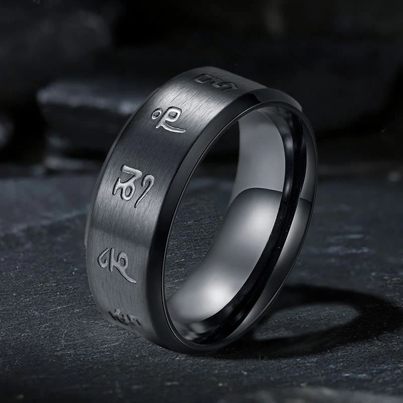 Anello di equilibrio in acciaio al titanio con mantra Jambhala nero Buddha Stones