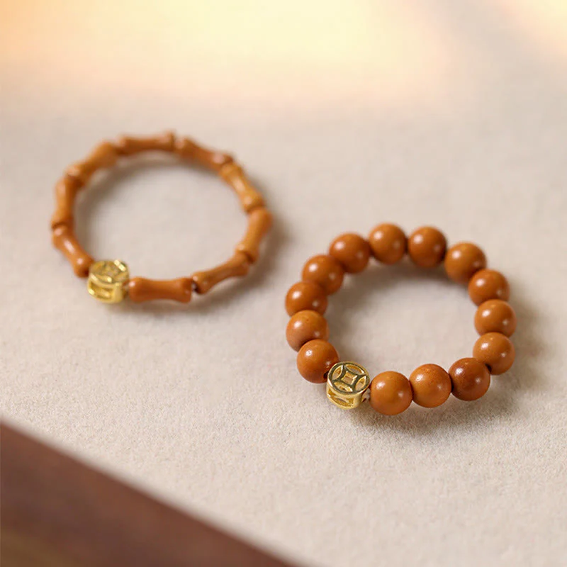 Anello di resistenza interna con moneta di rame e perlina di nocciolo di oliva Buddha Stones