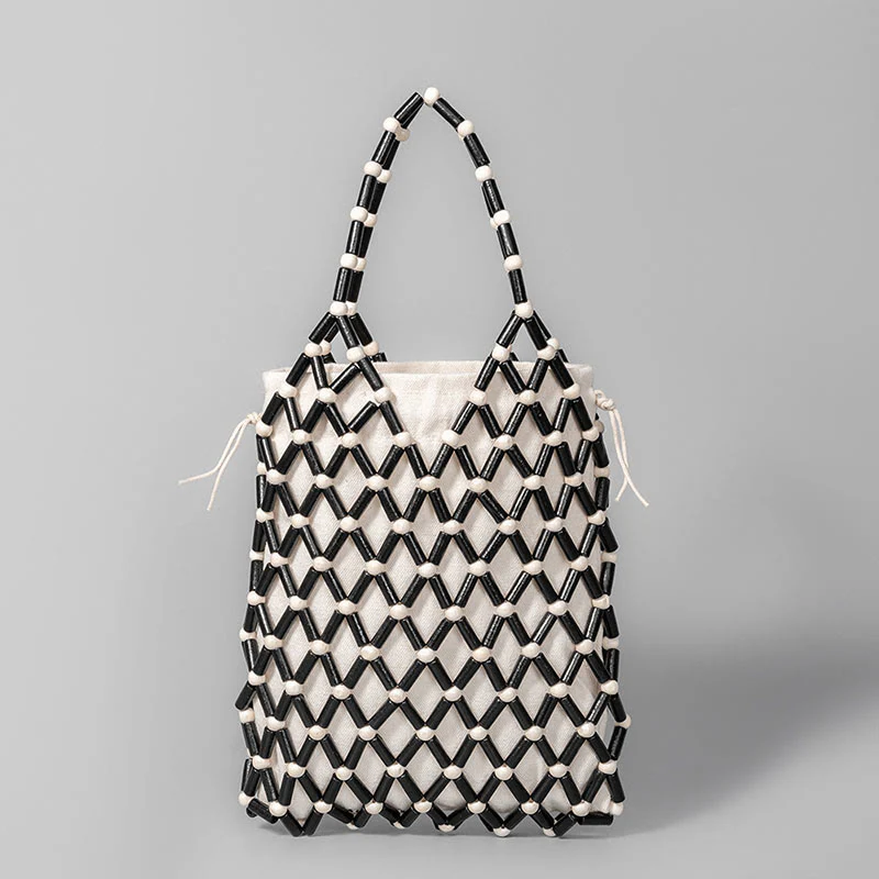 Borsa a mano con perline di legno cave intrecciate a mano in Buddha Stones