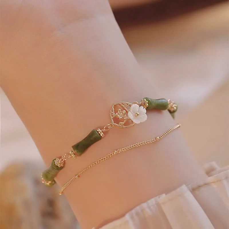 Bracciale Buddha Stones in rame placcato oro 14k con fiore di bambù, peridoto e doppio strato di ricchezza - Image 3
