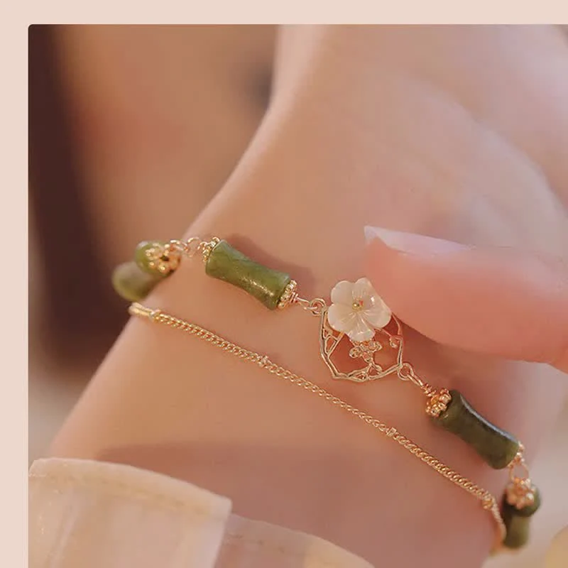 Bracciale Buddha Stones in rame placcato oro 14k con fiore di bambù, peridoto e doppio strato di ricchezza - Image 4