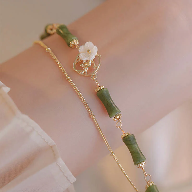 Bracciale Buddha Stones in rame placcato oro 14k con fiore di bambù, peridoto e doppio strato di ricchezza - Image 5