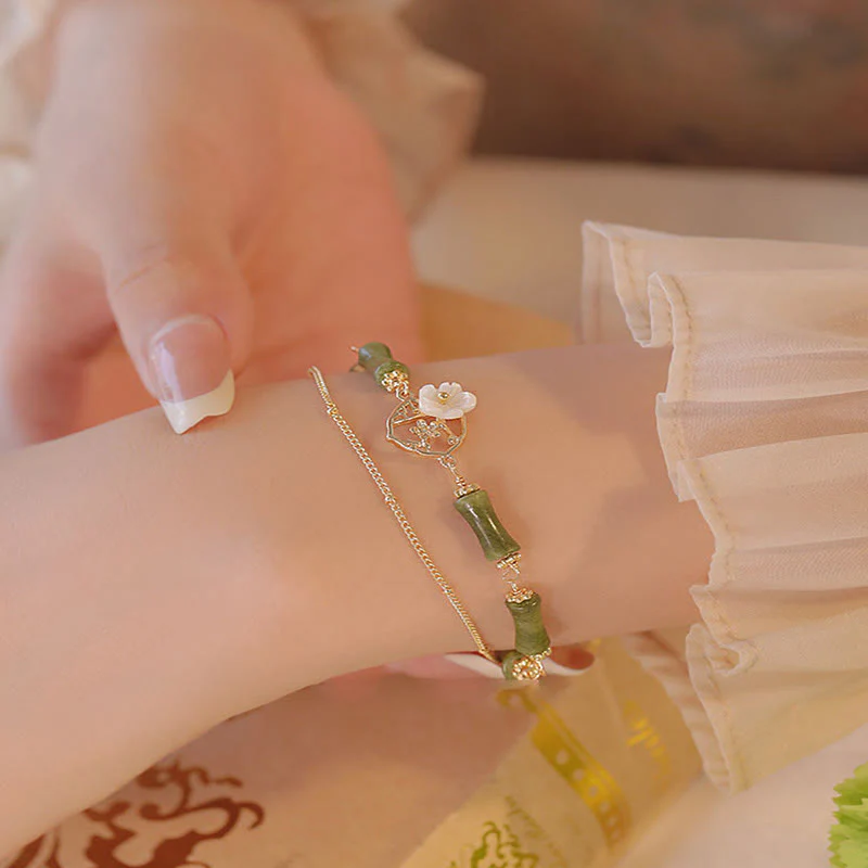 Bracciale Buddha Stones in rame placcato oro 14k con fiore di bambù, peridoto e doppio strato di ricchezza - Image 8
