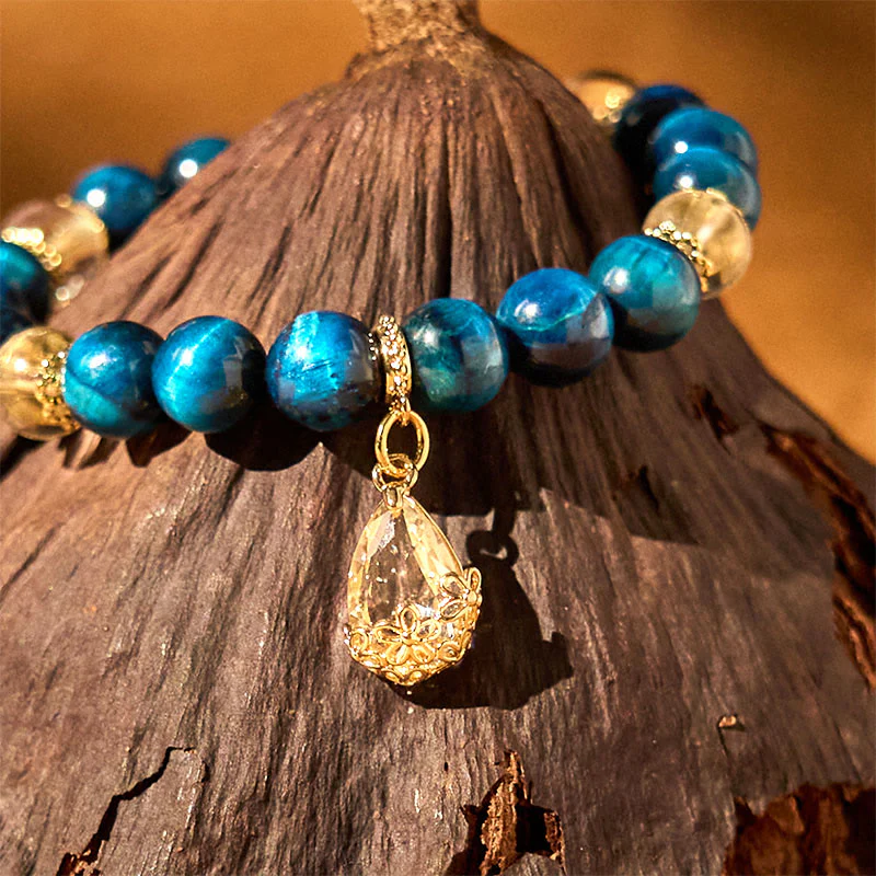 Bracciale Buddha Stones Occhio di Tigre Blu Cristallo Bianco Goccia d'Acqua Forza - Image 3
