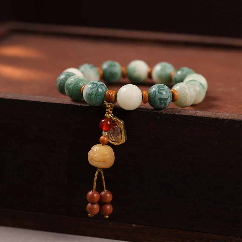 Bracciale della pace in zakiram intagliato con Buddha Stones e semi di Bodhi sfumati, Om Mani Padme Hum