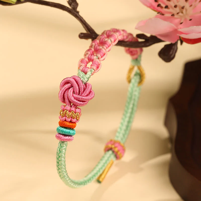 Bracciale intrecciato con nodo in fiore di pesco rosa e verde fatto a mano Buddha Stones - Image 2
