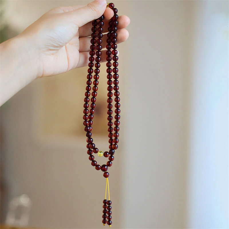 Braccialetto anti-ansia in ambra trasparente con 108 perle di Mala naturali Buddha Stones