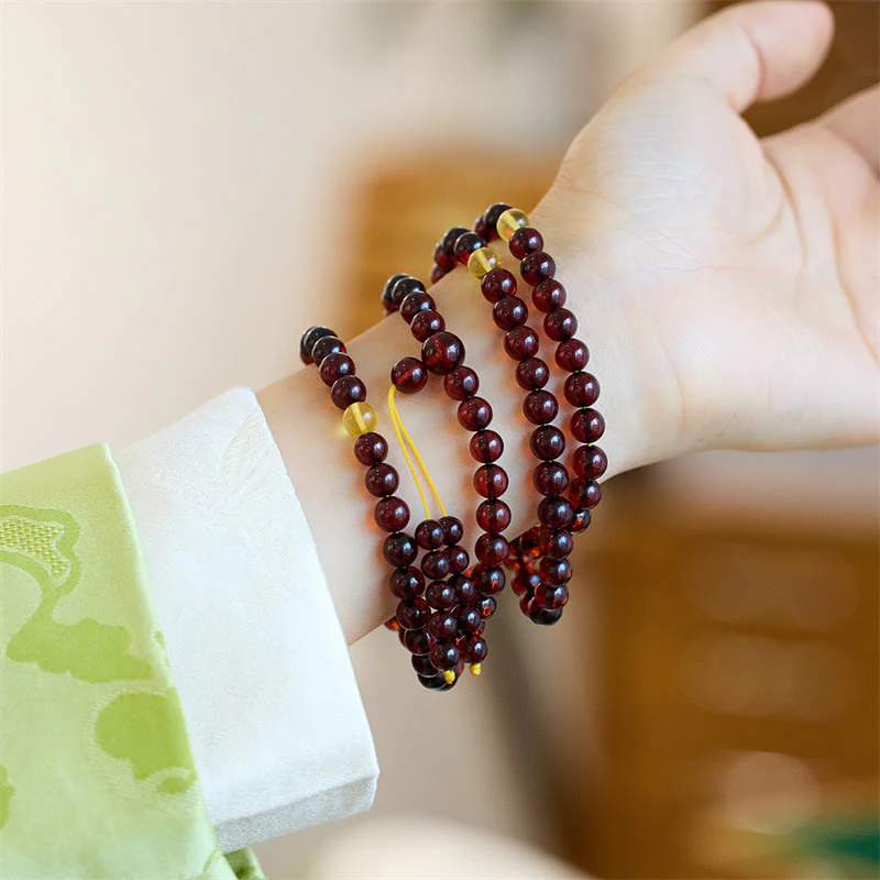 Braccialetto anti-ansia in ambra trasparente con 108 perle di Mala naturali Buddha Stones - Image 2