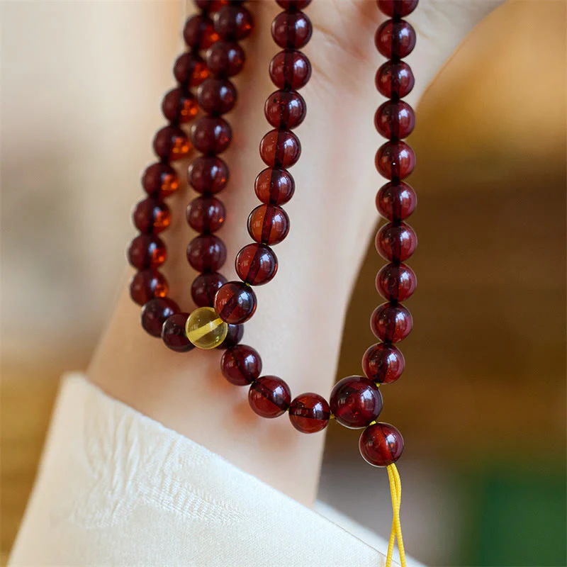 Braccialetto anti-ansia in ambra trasparente con 108 perle di Mala naturali Buddha Stones - Image 3