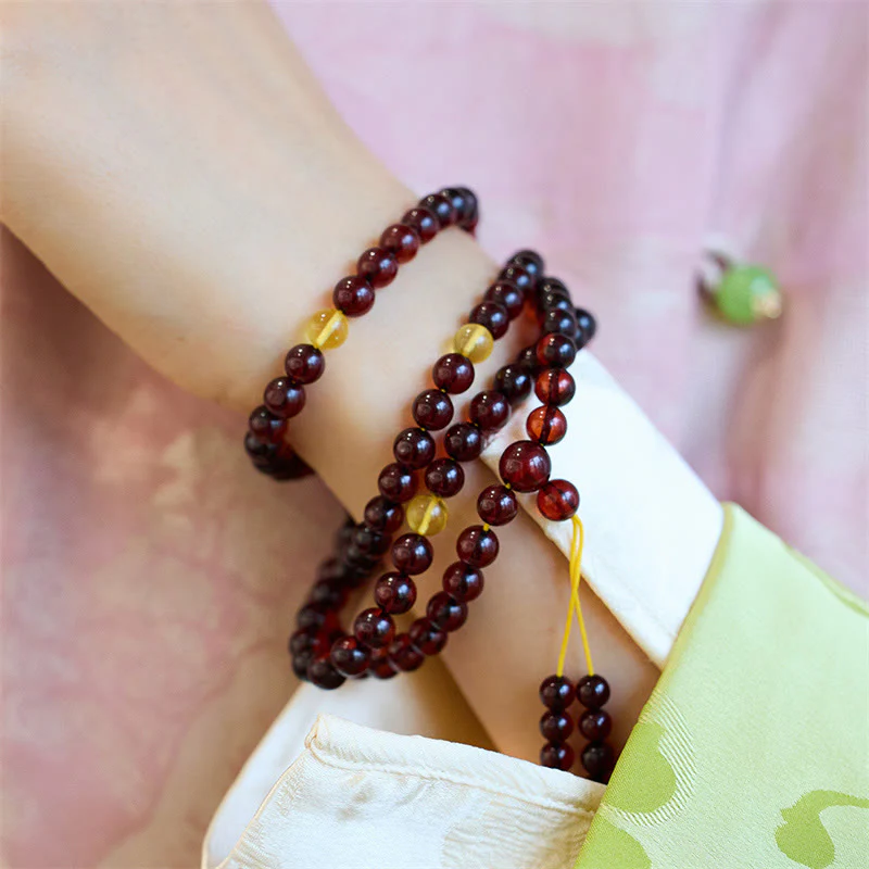 Braccialetto anti-ansia in ambra trasparente con 108 perle di Mala naturali Buddha Stones - Image 5