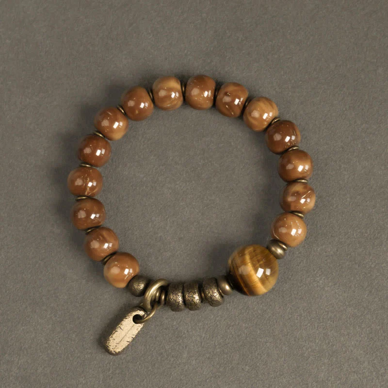 Braccialetto per la fortuna, in ottone, rame e ossidiana , Buddha Stones , semi di Kuka, occhio di tigre e oro lucido - Image 2