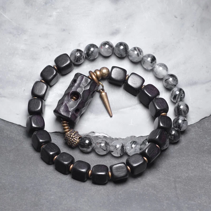 Braccialetto con bilanciere a doppio giro in ottone e rame, in legno di ebano e quarzo rutilato nero Buddha Stones