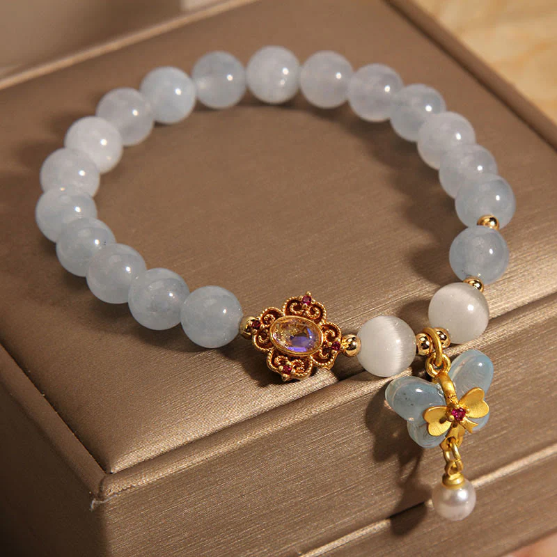 Braccialetto con ciondolo a forma di farfalla e perla con occhio di gatto e pietre Buddha Stones - Image 2