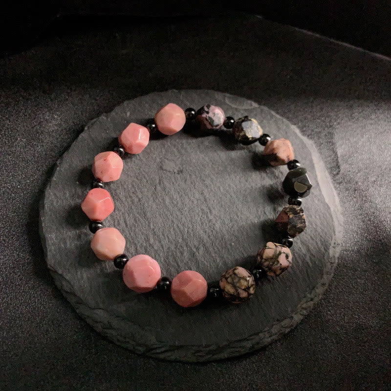 Braccialetto curativo con perline poligonali in pietra di rodonite naturale con linea nera e macchie rosse Buddha Stones - Image 2