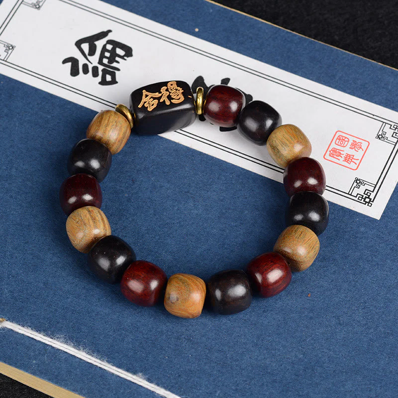 Braccialetto della pace in legno di sandalo rosso e legno di ebano Buddha Stones multicolore