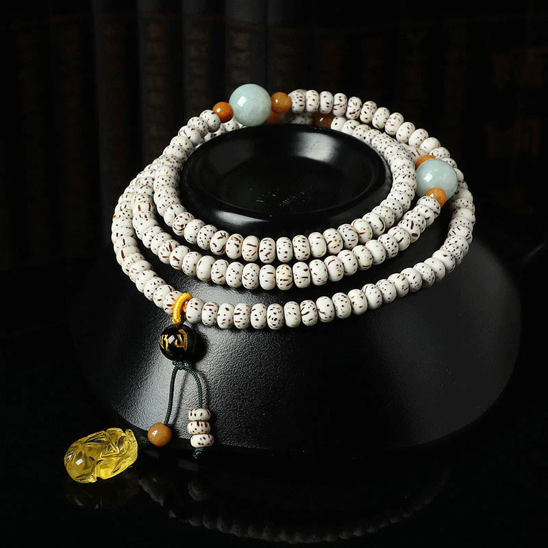 Braccialetto della ricchezza in agata ambrata con semi di Bodhi tibetano e pietre Buddha Stones