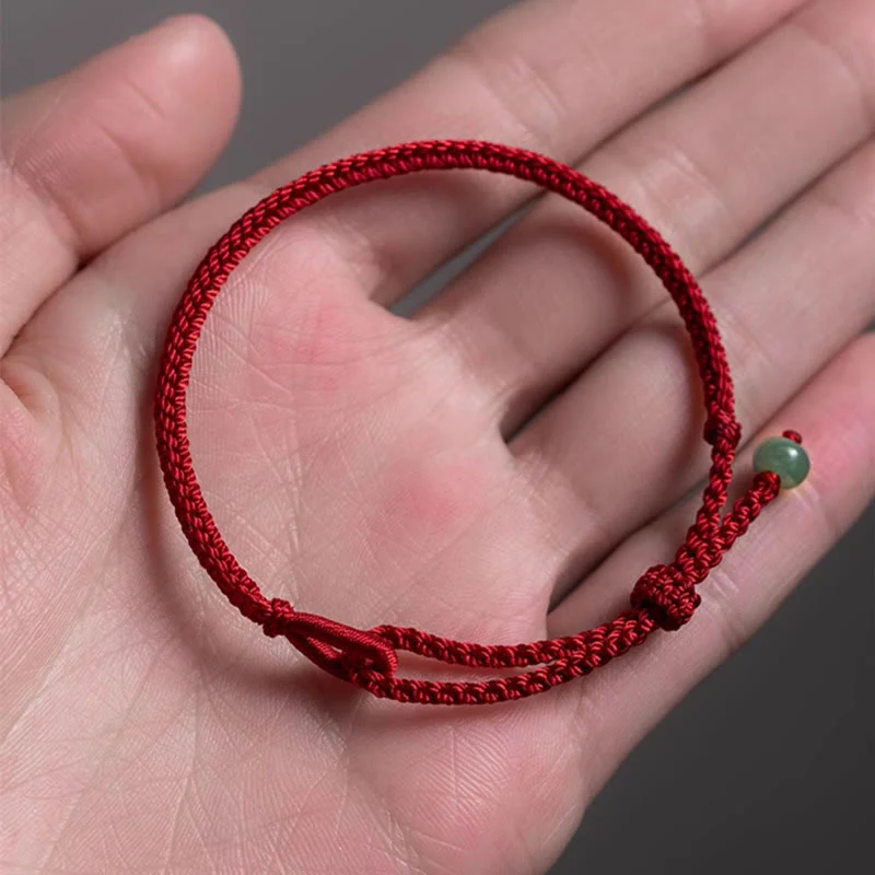 Braccialetto di collegamento in giada con filo rosso Buddha Stones