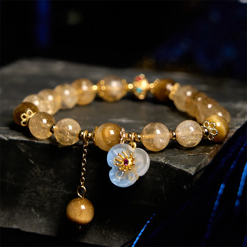 Braccialetto di generosità con ciondolo a forma di fiore con occhio di tigre e citrino Buddha Stones