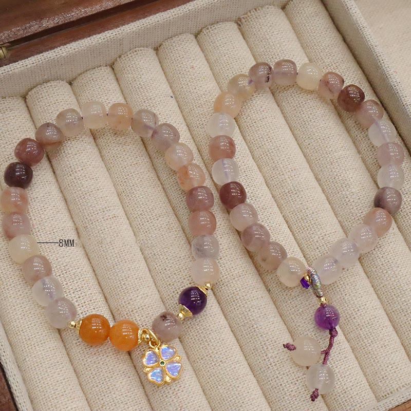 Braccialetto di perline con ciondolo a forma di fiore viola dorato naturale di seta Buddha Stones - Image 13