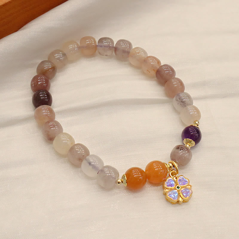 Braccialetto di perline con ciondolo a forma di fiore viola dorato naturale di seta Buddha Stones - Image 4