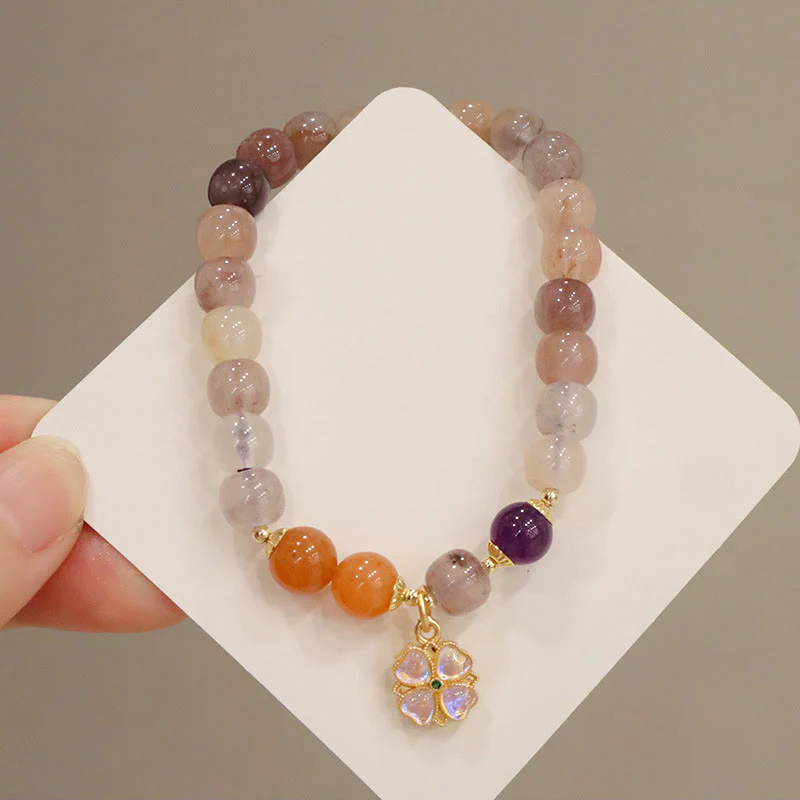 Braccialetto di perline con ciondolo a forma di fiore viola dorato naturale di seta Buddha Stones - Image 5