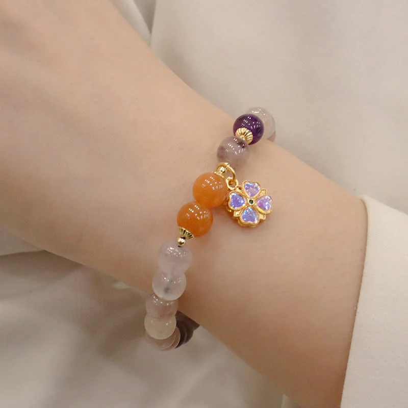 Braccialetto di perline con ciondolo a forma di fiore viola dorato naturale di seta Buddha Stones - Image 6