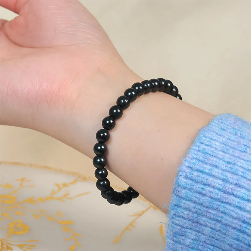 Braccialetto di perline con forza interiore in pietra di shungite autentica e rotonda Buddha Stones - Image 4