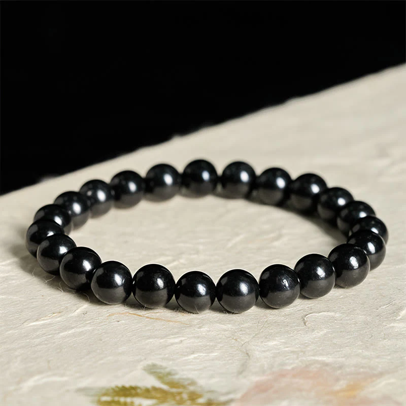 Braccialetto di perline con forza interiore in pietra di shungite autentica e rotonda Buddha Stones - Image 9