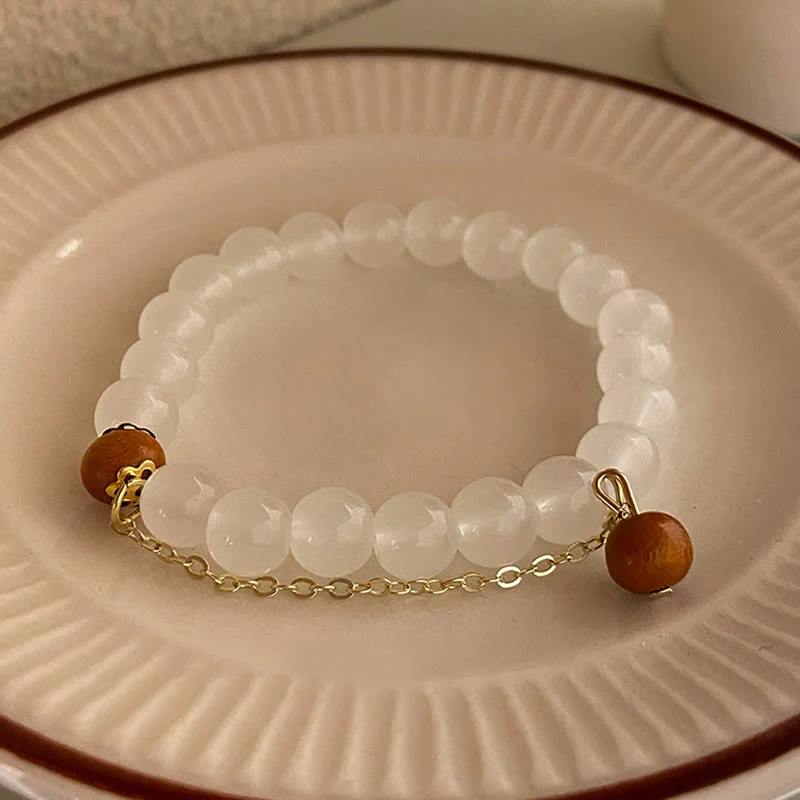 Braccialetto di protezione con ciondolo a forma di carattere Fu con occhio di gatto Buddha Stones in legno di sandalo - Image 10