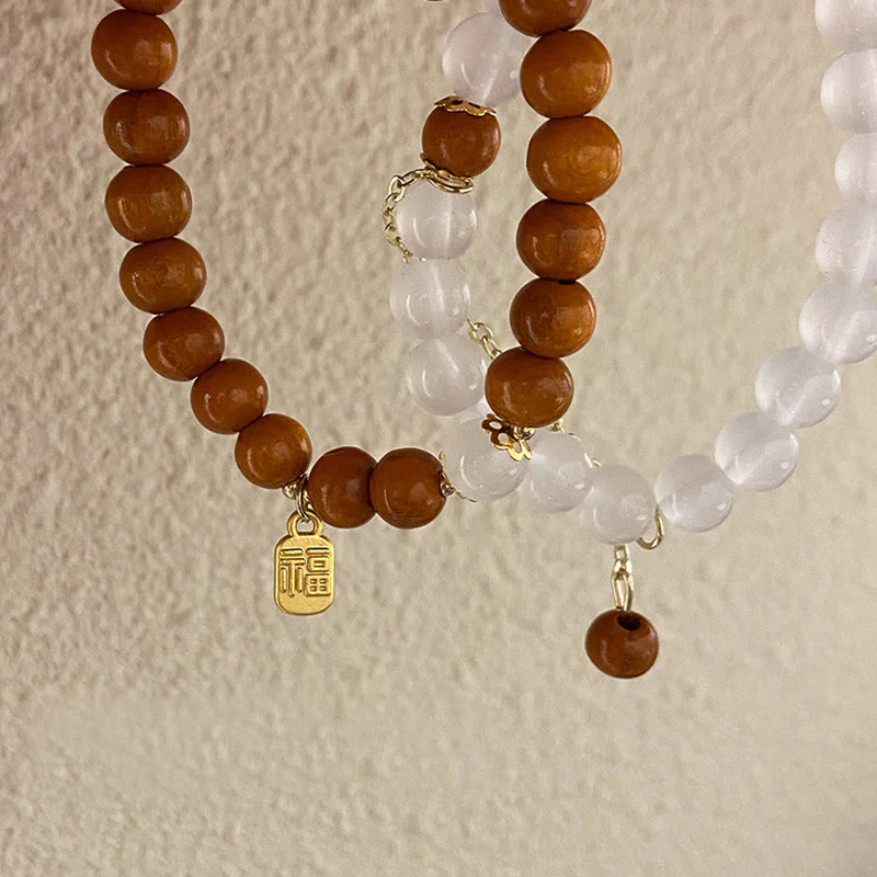 Braccialetto di protezione con ciondolo a forma di carattere Fu con occhio di gatto Buddha Stones in legno di sandalo - Image 15