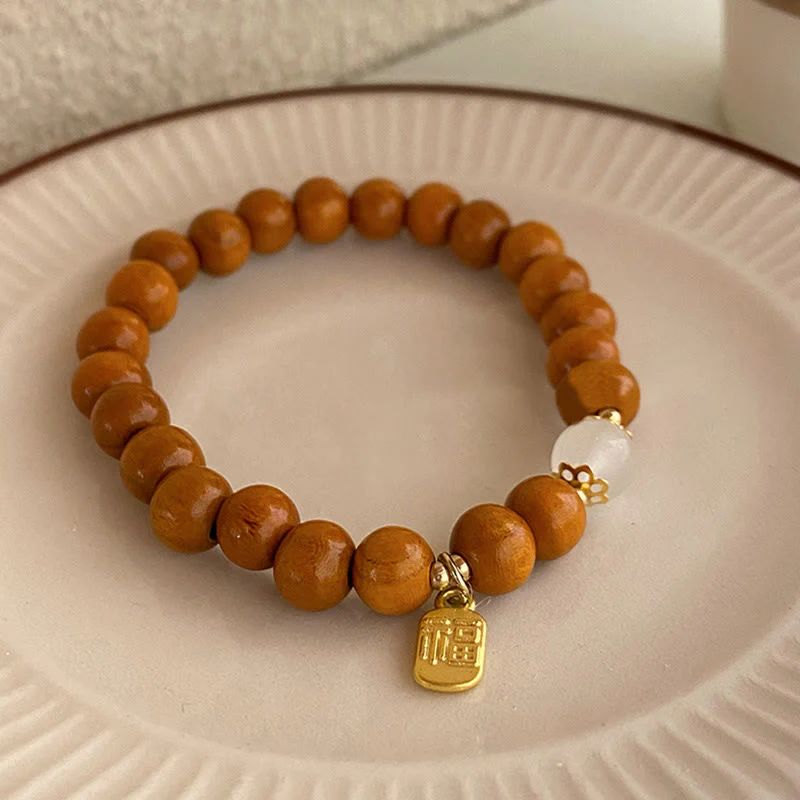 Braccialetto di protezione con ciondolo a forma di carattere Fu con occhio di gatto Buddha Stones in legno di sandalo - Image 3