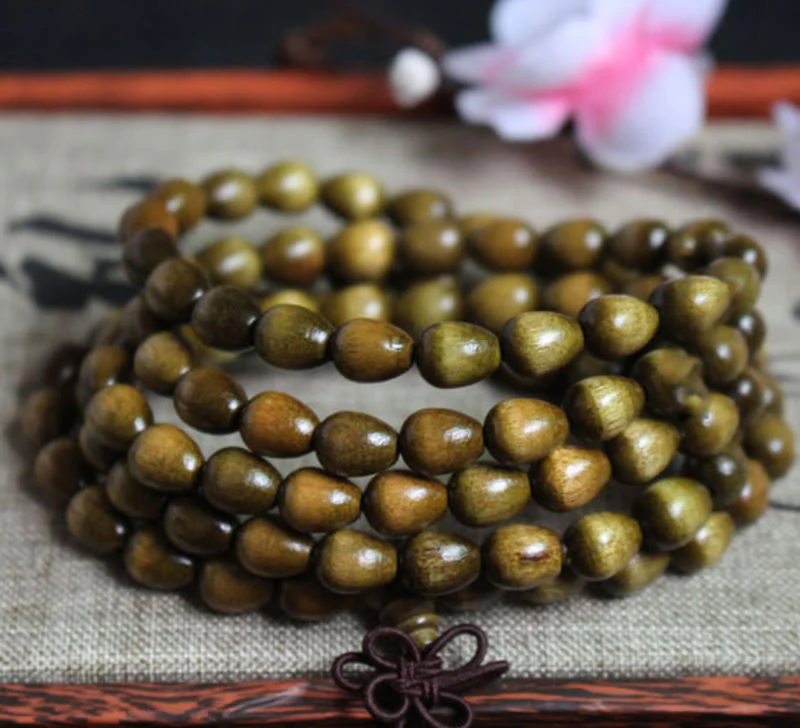 Braccialetto di protezione in legno naturale Phoebe Zhennan con 108 perle a goccia Mala Buddha Stones - Image 2
