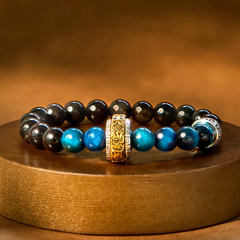 Braccialetto di protezione in occhio di tigre blu ossidiana e argento lucido Buddha Stones