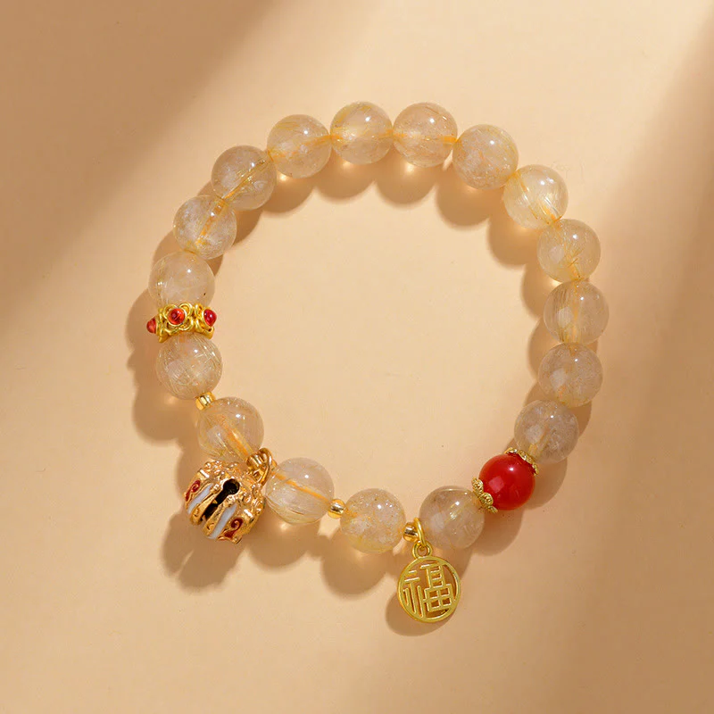 Braccialetto di ricchezza con ciondolo a forma di campana con carattere Fu in quarzo rutilato dorato naturale Buddha Stones - Image 2