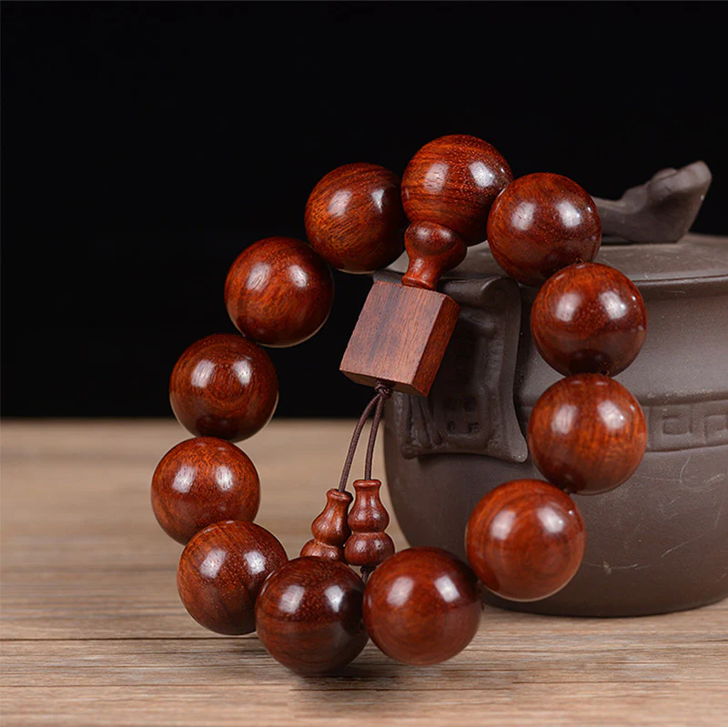 Braccialetto di rilassamento in legno di sandalo rosso con foglie piccole tibetane Buddha Stones - Image 6