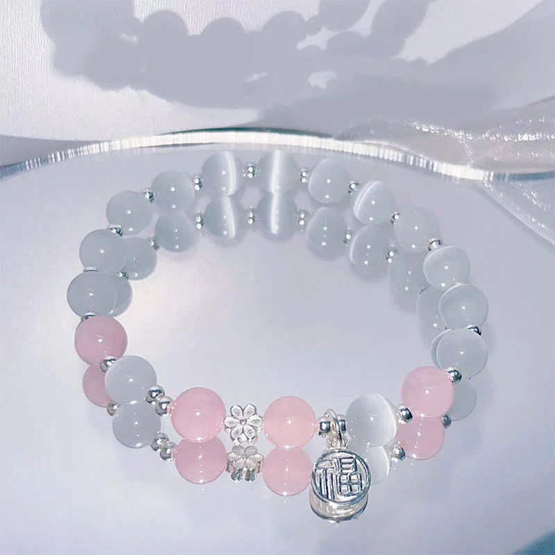 Braccialetto di supporto con ciondolo a forma di carattere Fu con campanella in fiore di pesco e cristalli occhio di gatto Buddha Stones - Image 4