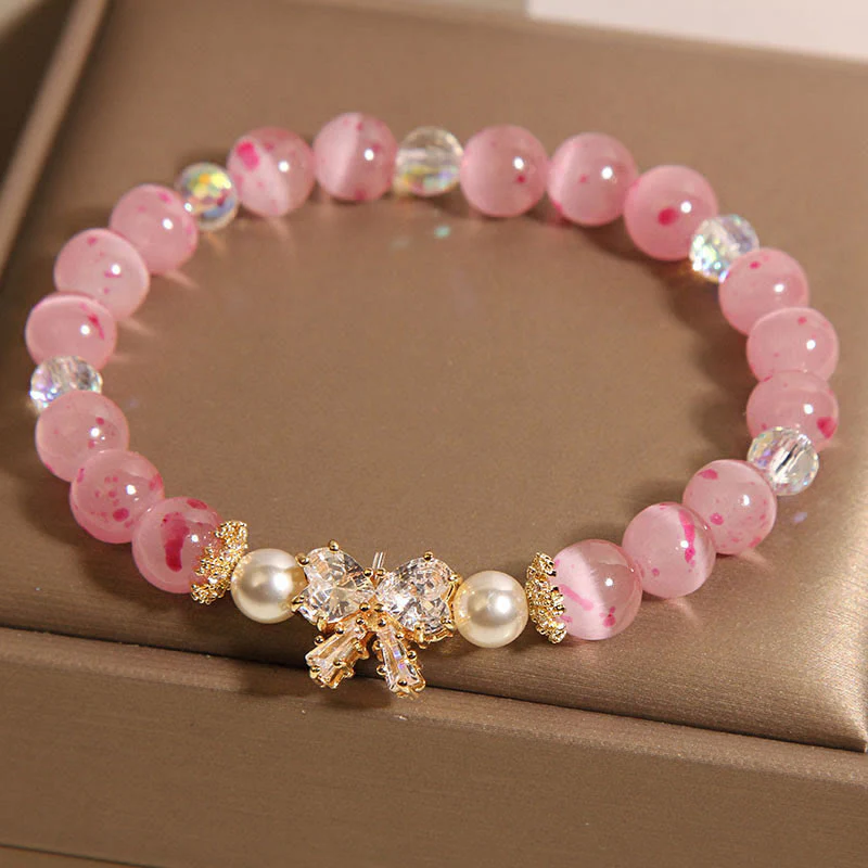 Braccialetto di supporto con fiocco e rosetta, in perle occhio di gatto rosa e fiori di ciliegio Buddha Stones - Image 2