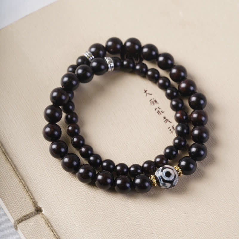 Braccialetto doppio giro in perline di legno di ebano del Tibet Dzi Buddha Stones