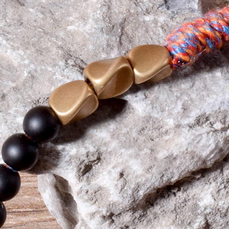 Braccialetto fatto a mano in onice nero tibetano con nappa Buddha Stones - Image 9