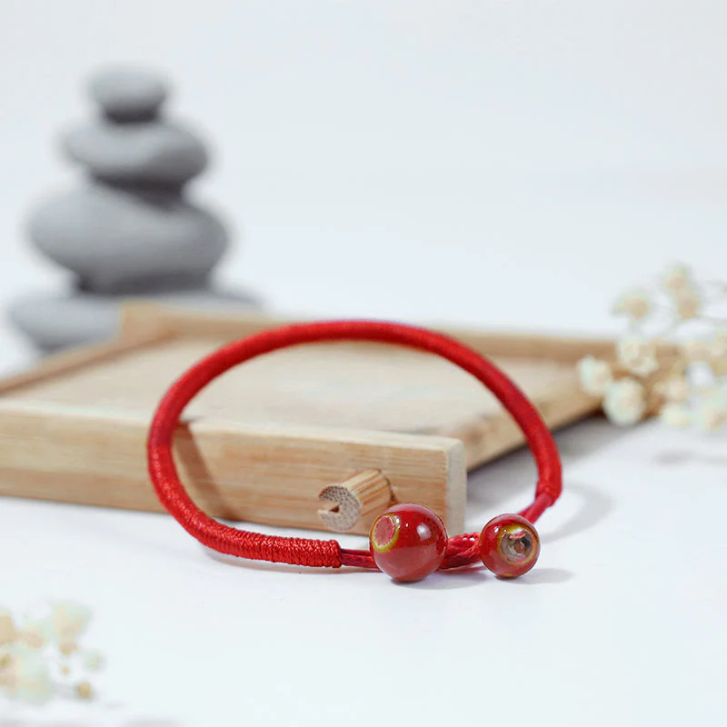 Braccialetto in ceramica con corda rossa portafortuna FengShui Buddha Stones - Image 3