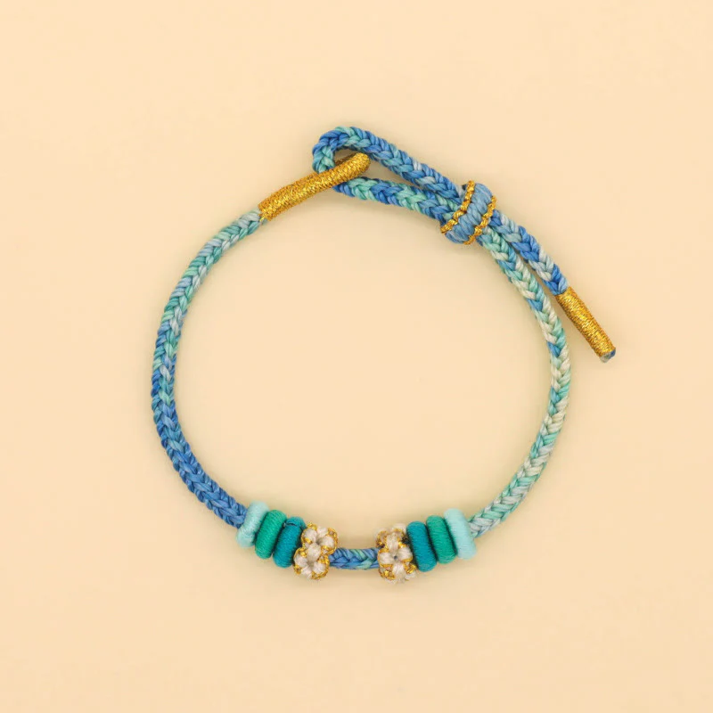 Braccialetto intrecciato con corda Buddha Stones a forma di nodo della pace a otto fili fatto a mano con nodo di fiori di pesco - Image 11