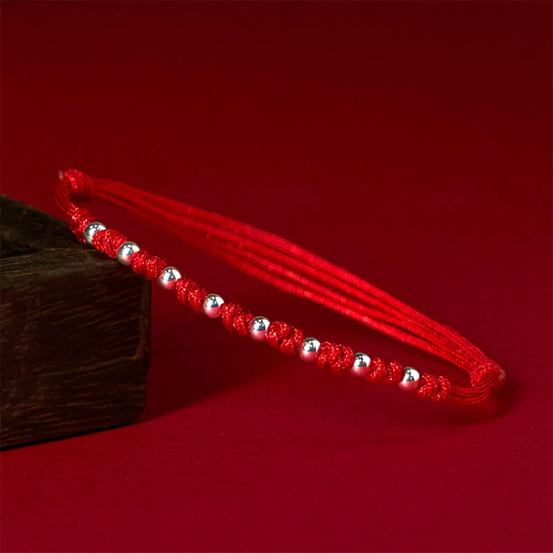 Braccialetto portafortuna regolabile con perline in argento sterling 925 e cordino rosso Buddha Stones
