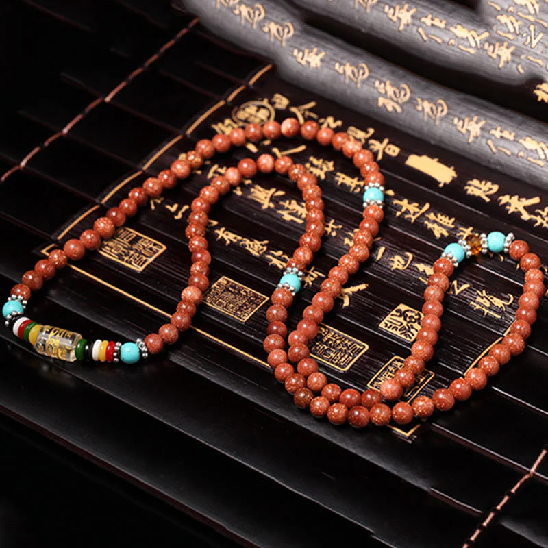Buddha Stones 108 Mala Beads Goldstone Om Mani Padme Hum Swastika Braccialetto di Fiducia - Image 8
