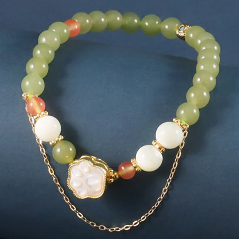 Buddha Stones Bracciale portafortuna con design a zampa di gatto in giada Hetian naturale e pietra Tridacna.