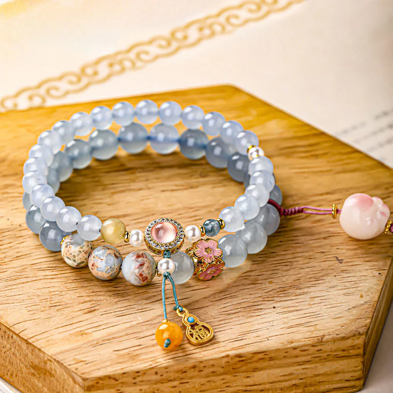 Buddha Stones Braccialetto curativo a forma di zampa di gatto con carattere Fu in calcedonio blu