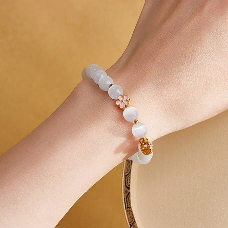 Buddha Stones Braccialetto portafortuna in argento sterling 925 con fiore di pesco e occhio di gatto bianco - Image 12