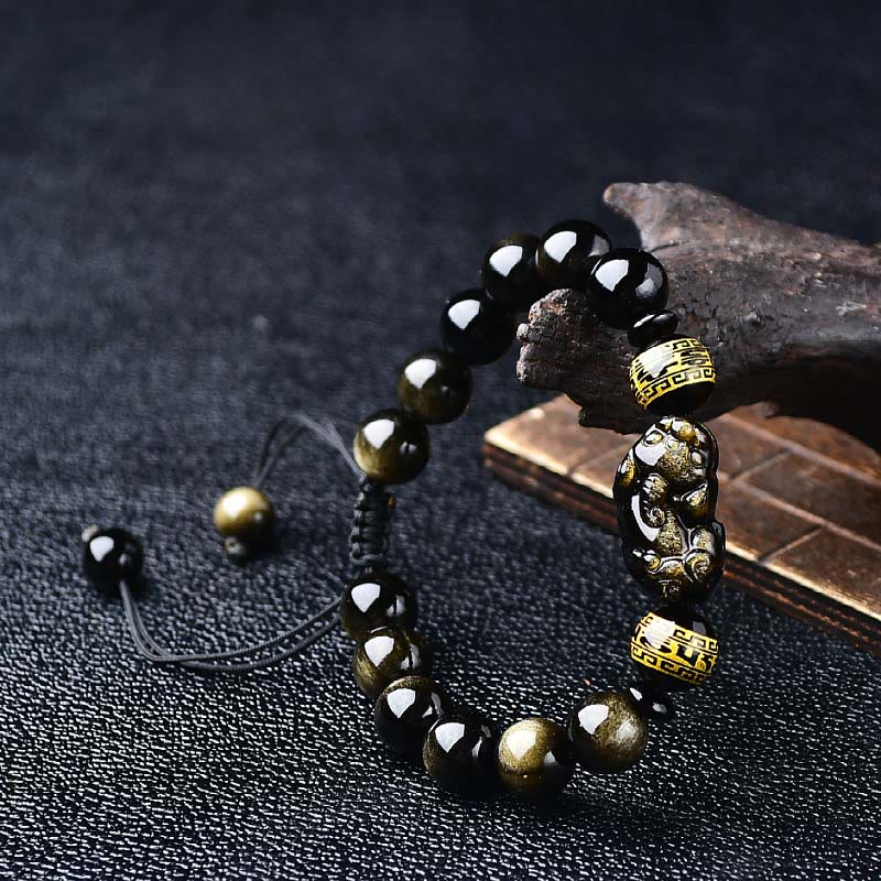 Buddha Stones Braccialetto protettivo PiXiu Om Mani Padme Hum in ossidiana con lucentezza dorata naturale, con scritta "PiXiu Om Mani Padme Hum".