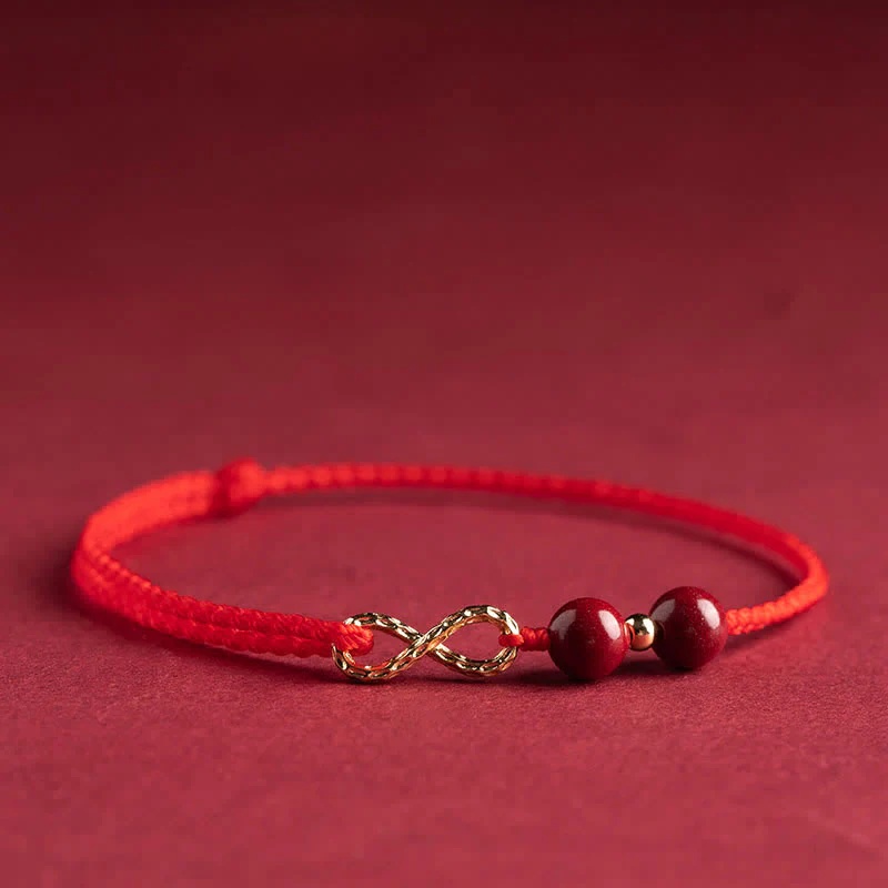 Braccialetto alla cavigliera con simbolo dell'infinito dorato e cordino rosso con Buddha Stones e cinabro. - Image 10