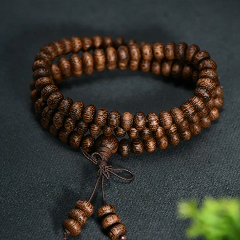 Buddha Stones Mala con 108 perline di legno testurizzate per un'energia calmante - Image 2