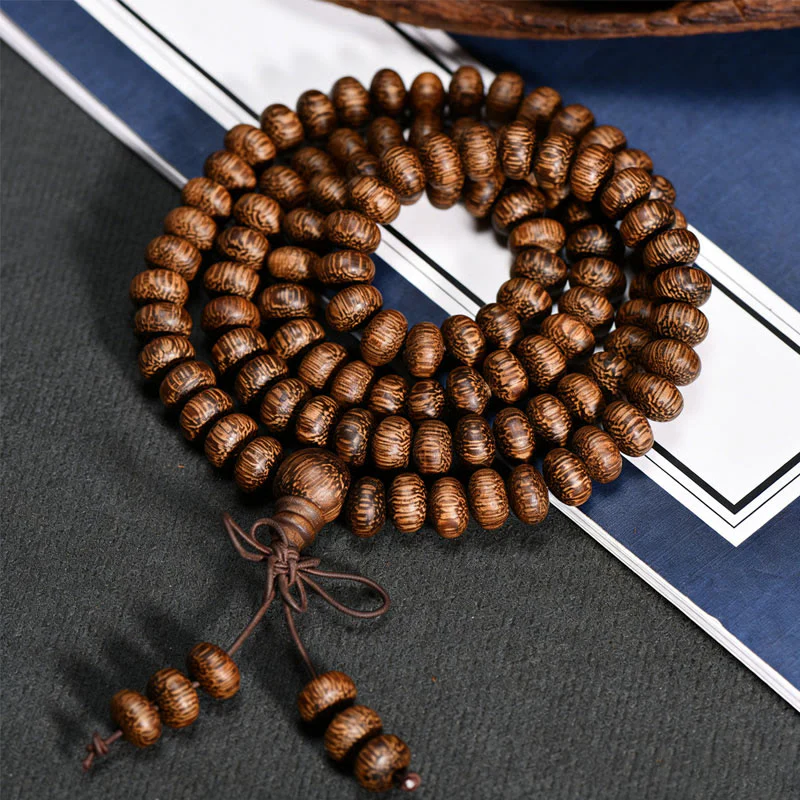 Buddha Stones Mala con 108 perline di legno testurizzate per un'energia calmante - Image 3